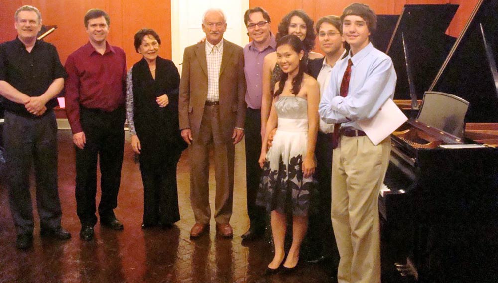 Ernst Mahle, Cidinha Mahle, and musicians posing in Steinway Hall, New York, NY, at a concert of Mahle's music